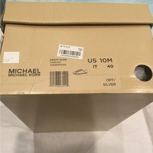 Woman’s Michael Kors dressed up sneakers